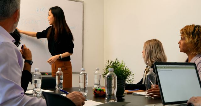 Female Executive Leading Business Meeting at Office - Download Free Stock Images Pikwizard.com