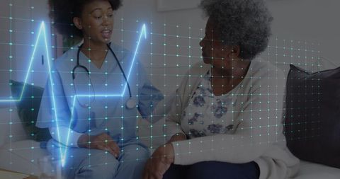 Healthcare Professional Assisting Senior Woman with Heart Rate Graphic