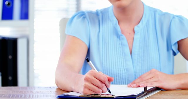 Businesswoman Writing Notes in Home Office Workspace - Download Free Stock Images Pikwizard.com