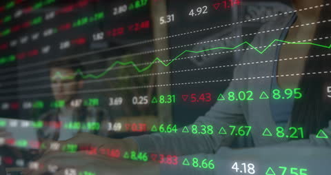 Financial Graphs Overlay on Businesswoman Using Laptop