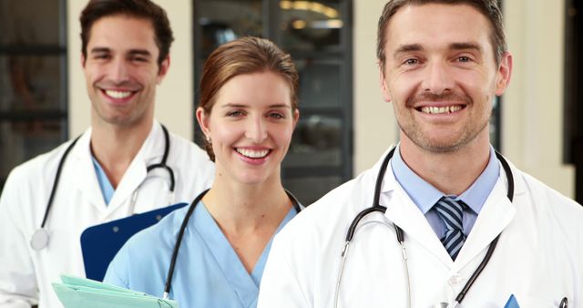 Smiling Medical Professionals Working Together in Hospital Corridor - Download Free Stock Images Pikwizard.com