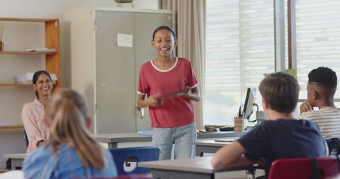 Girl Presenting on Tablet in Classroom Engagement