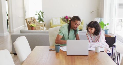 Interracial Couple Collaborating on Laptop in Modern Living Room - Download Free Stock Images Pikwizard.com