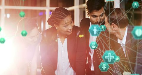 Diverse Business Team Engaging with Digital Network Visuals