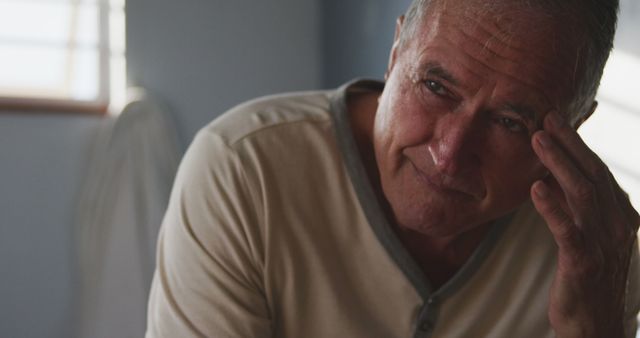 Worried Elderly Man Contemplating Indoors in Emotional Moment - Download Free Stock Images Pikwizard.com