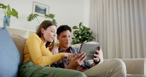 Couple Relaxing and Using Tablet for Entertainment at Home - Download Free Stock Images Pikwizard.com