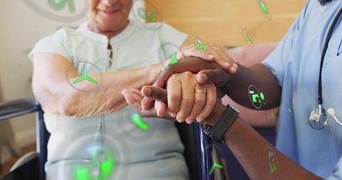 Caregiver holding senior hands with empathy, nurse in scrubs and ar health icons