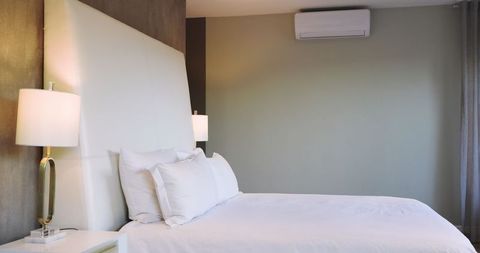 Minimalist Modern Bedroom with Upholstered Bed and Air Conditioning