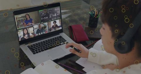 Focused korean student studying in online class with laptop