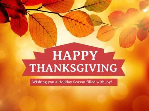 Thanksgiving greeting with warm autumn leaves and festive message