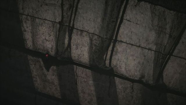 Underpass concrete panels revealing sealed seams, weathered texture and moody urban grit