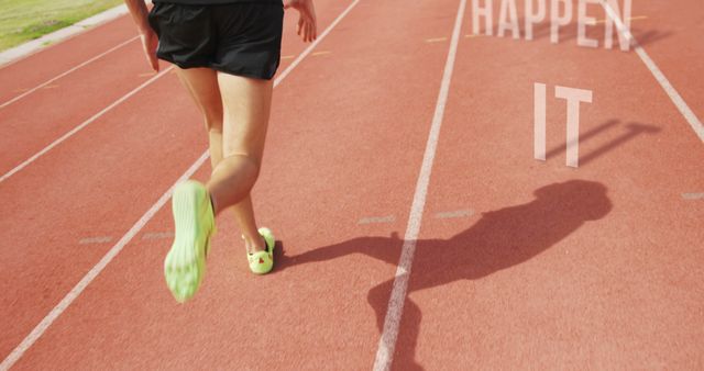 Runner Jogging on Track with Motivational Words Happen It - Download Free Stock Images Pikwizard.com