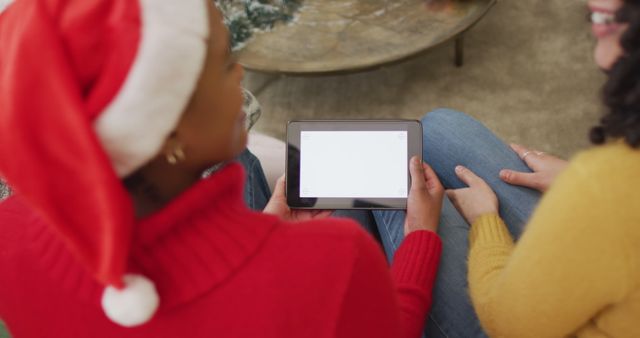 Women Using Tablet During Christmas Celebration - Download Free Stock Images Pikwizard.com