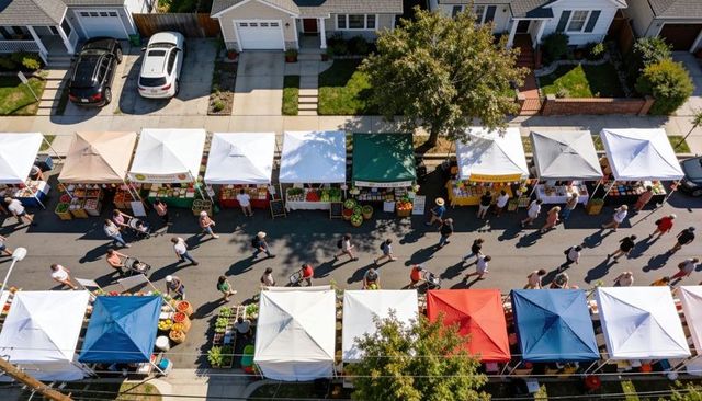 Aerial view neighborhood market bustling with colorful vendor tents, shoppers, produce