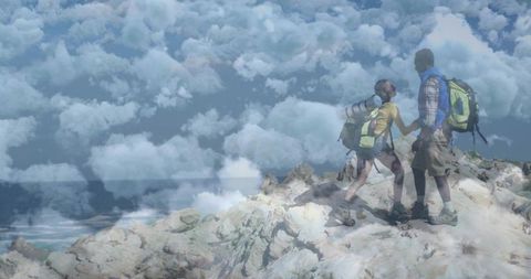 Couple Hiking Embracing Scenic Mountain Peaks and Clouds
