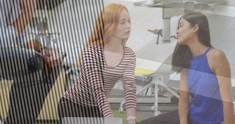 Diverse Women Training with Coach in Modern Gym Environment