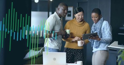 Diverse Team Collaborating on Digital Financial Data in Office