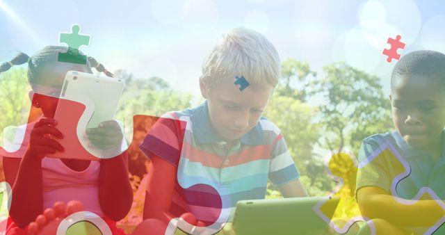 Diverse children using tablets in park with puzzle pieces overlay - Download Free Stock Images Pikwizard.com