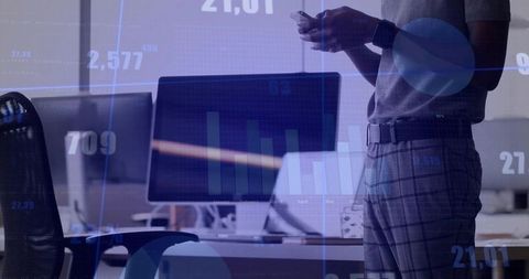 Businessman using smartphone with digital analytics overlay