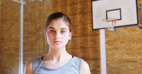 Young Female Athlete in Gymnasium Focused for Training