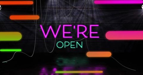 Glowing we're open neon sign with magenta and teal bars, cables and floor reflections