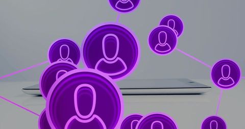 Neon purple network glowing avatars connecting over closed silver laptop for teamwork