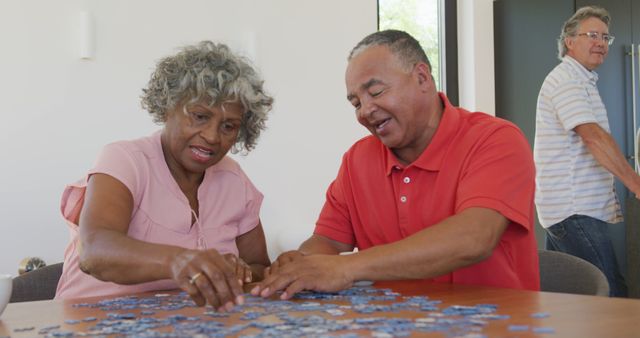 Seniors Engaged in Solving Jigsaw Puzzle Together - Download Free Stock Images Pikwizard.com