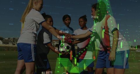Female soccer team huddling with digital chart overlay