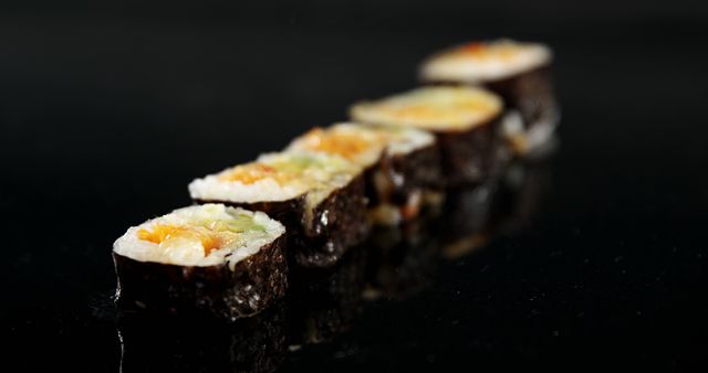 Shiny Row of Fresh Sushi Rolls on Black Background - Download Free Stock Images Pikwizard.com