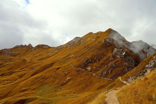 Majestic Mountain Range with Hiking Trail in Autumn - Download Free Stock Photos Pikwizard.com