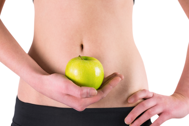 Woman's Bare Midsection Holding Green Apple Over Transparent Background - Download Free Stock Videos Pikwizard.com