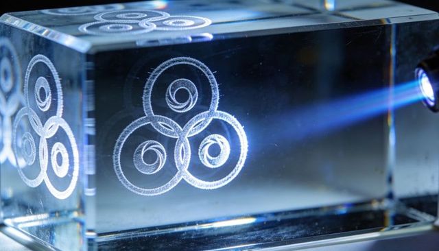 Blue laser illuminating crystal block with triple spiral etching for optics