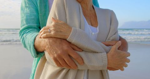 Senior Couple Embracing on Serene Beach