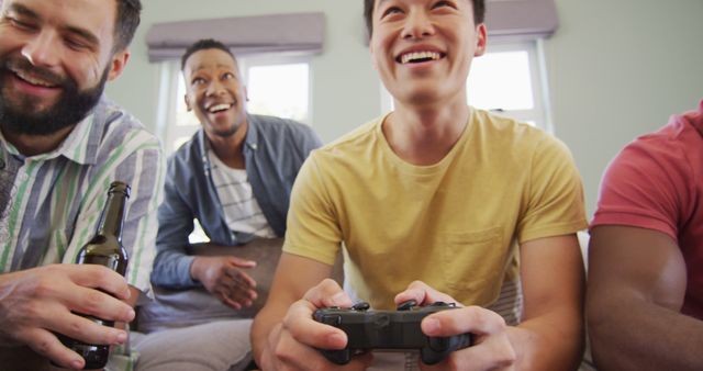 Diverse group of friends enjoying video game session together indoors - Download Free Stock Images Pikwizard.com