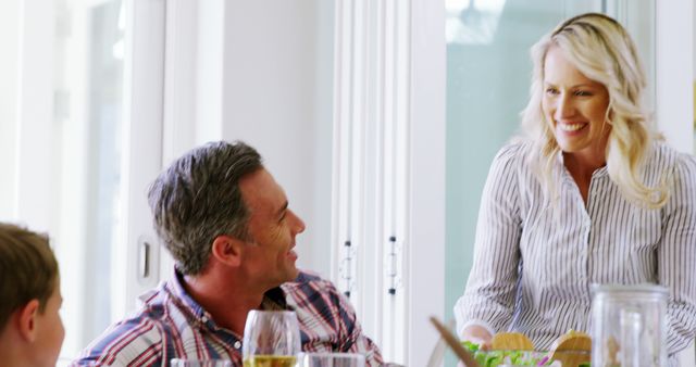 Family Enjoying Meal Together At Bright Dining Room - Download Free Stock Images Pikwizard.com