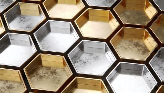 Brushed gold and silver hexagon honeycomb pattern with worn patina and reflective surfaces