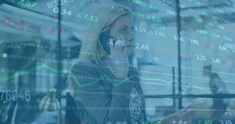 Blonde Businesswoman Holding Smartphone, Talking and Monitoring Stock Market Tickers