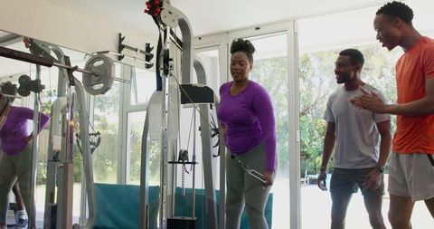 Friends Enjoying Workout Together in Home Gym Setting