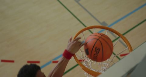 Basketball Player Dunking Ball on Indoor Court - Download Free Stock Images Pikwizard.com