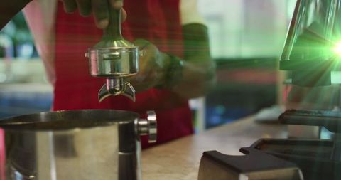 Barista preparing espresso shot in vibrant coffee shop