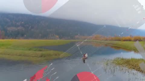 Canoeing Through Serene Marshland with Futuristic Infographics Overlay