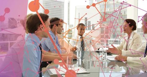 Business leaders collaborating over data visualization overlay in modern glass boardroom