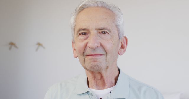 Senior Man Smiling in Casual Light Blue Shirt - Download Free Stock Images Pikwizard.com