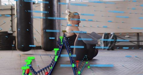 Female athlete performing v-sit core workout in gym with futuristic neon data overlay