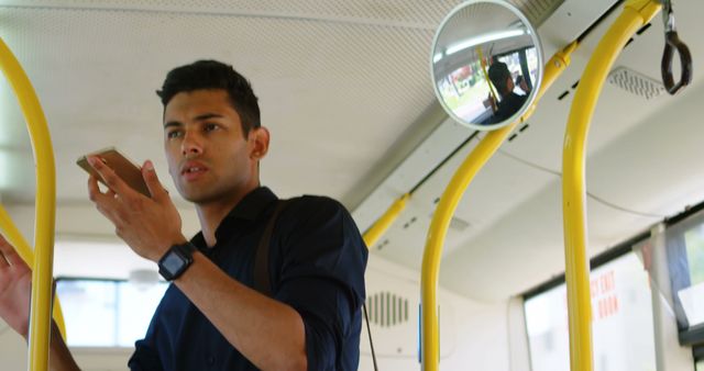 Young Man Talking on Smartphone Inside Public Bus - Download Free Stock Images Pikwizard.com