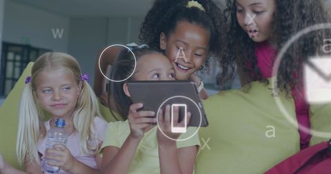 Diverse Schoolgirls Sharing Digital Tablet with Media Elements