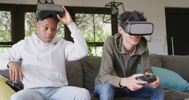 Two Friends Playing Virtual Reality Video Games on Couch - Download Free Stock Images Pikwizard.com
