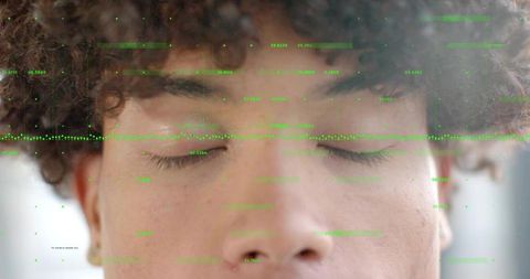 Closeup adult male with closed eyes and neon green biometric HUD overlay for identity tech