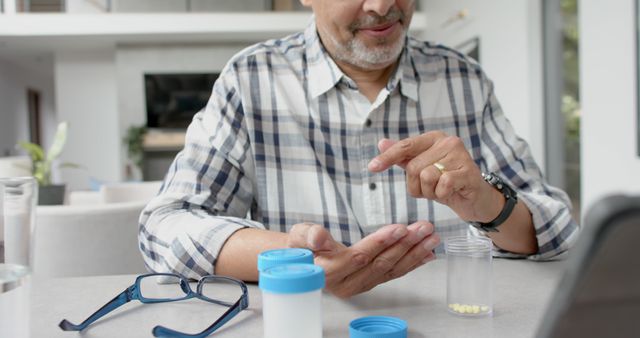 Senior Man Taking Medication at Home in Bright Interior - Download Free Stock Images Pikwizard.com