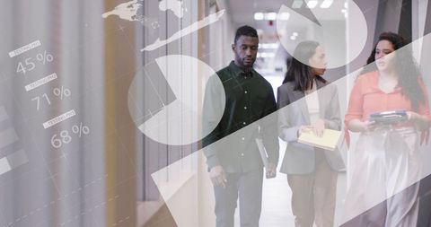 Diverse Team Analyzing Business Reports and Data in Modern Office